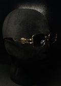 VERSACE Gafas negro montura dorada